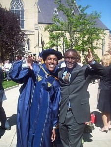 Bobby Brown and his older brother displaying the Omega Psi Phi Fraternity sign.