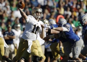 Notre Dame quarterback Tommy Rees (11) passes against Air Force in the first quarter of an NCAA football game in Air Force Academy, Colo., Saturday, Oct. 26, 2013. (AP Photo/David Zalubowski)