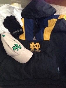 The ND gear left at my door, trash bag included. Not pictured, a gold ND beanie I found later in the jacket pocket.