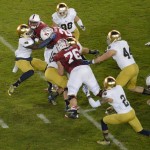 Dan Fox & Jaylon Smith bring down a Stanford ball carrier. (Daniel Hartwig via Flickr)