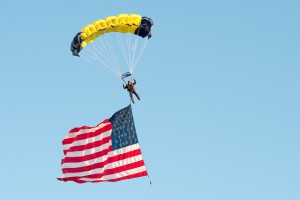 A member of the Navy Leap Frogs, the U.S. Navy’s Parachute Demonstration Team, chutes on to the field before a football game at Notre Dame Stadium in South Bend, Ind., Sept. 6, 2014. DoD Photo by Mass Communication Specialist 1st Class Daniel Hinton.
