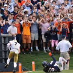 Virginia fans react as Notre Dame's Will Fuller (7) scores on a touchdown pass with UVA's Maurica Canady (26) falling after attempting to stop the play during an NCAA college football game in Charlottesville, Va., Saturday, Sept. 12, 2015. (P. Kevin Morley/AP)