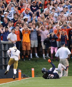 Virginia fans react as Notre Dame's Will Fuller (7) scores on a touchdown pass with UVA's Maurica Canady (26) falling after attempting to stop the play during an NCAA college football game in Charlottesville, Va., Saturday, Sept. 12, 2015. (P. Kevin Morley/AP)