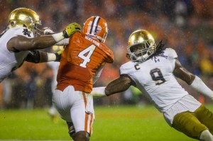 Notre Dame’s Jerry Tillery (99), left, and Jaylon Smith (9) bring down Clemson’s Deshaun Watson(4). SBT Photo/ROBERT FRANKLIN
