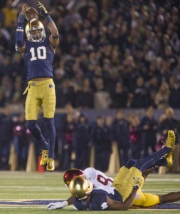Notre Dame’s Max Redfield (10) intercepts a pass tipped by teammate KeiVarae Russell (6) and USC’s JuJu Smith-Schuster (9) during the Notre Dame-Southern Cal football game on Saturday, Oct. 17, 2015. SBT Photo/ROBERT FRANKLIN