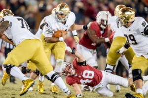 Notre Dame Fighting Irish quarterback DeShone Kizer (14) carries the ball as Stanford Cardinal linebacker Kevin Anderson (48) defends in the fourth quarter at Stanford Stadium. Stanford won 38-36. Matt Cashore/USA TODAY Sports