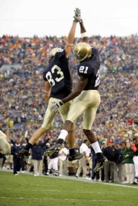 Maurice Stovall and Jeff Samardzija celebrate after Stovall's 35-yard TD pass from Brady Quinn. [Michael Conroy / AP]