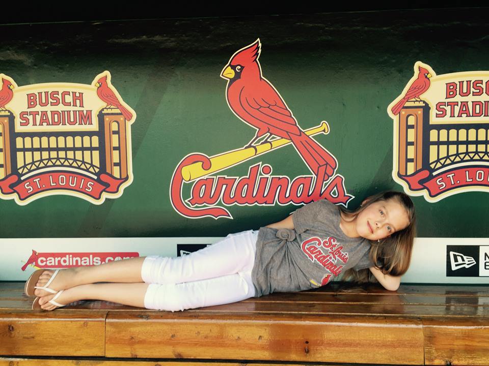 Raquel taking a break during photo session. Not a bad place to hangout, The Cardinals Dugout! — at Busch Stadium. June 2015
