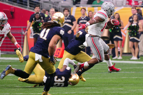 Buckeyes running back Ezekiel Elliott (15) carries the ball as Notre Dame safety Elijah Shumate (22), cornerback Matthias Farley (41) and cornerback Cole Luke (36) defend. Matt Kartozian-USA TODAY Sports