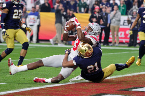 Ohio State wide receiver Michael Thomas (3) scores a 15 yard touchdown as Notre Dame cornerback Nick Watkins (21) defends. Matt Kartozian-USA TODAY Sports