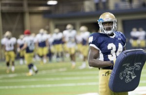 Dexter Williams (34) runs drills with his teammates during Notre Dame spring football practice inside the Loftus Center. (Tribune Photo/BECKY MALEWITZ)