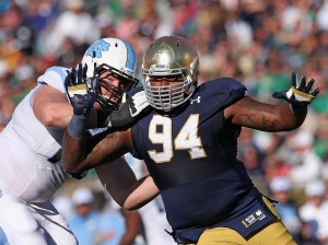 SOUTH BEND, IN - OCTOBER 11: Jarron Jones #94 of the Notre Dame Fighting Irish rushes against Jon Heck #71 of the North Carolina Tar Heels at Notre Dame Stadium on October 11, 2014 in South Bend, Indiana. (Photo by Jonathan Daniel/Getty Images)