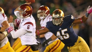 SOUTH BEND, IN - OCTOBER 19: Cody Kessler #6 of the University of Southern California Trojans passes as Romeo Okwara #45 of the Notre Dame Fighting Irish rushes at Notre Dame Stadium on October 19, 2013 in South Bend, Indiana. Notre Dame defeated USC 14-10.  (Photo by Jonathan Daniel/Getty Images)