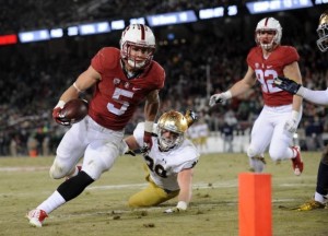 Stanford Cardinal running back Christian McCaffrey (5) runs the ball against Notre Dame Fighting Irish linebacker Joe Schmidt (38) during the second half at Stanford Stadium. Credit: Gary A. Vasquez/USA TODAY Sports