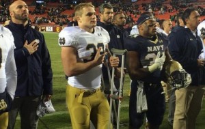 Irish linebacker Joe Schmidt stands with members of the Navy Football team during Navy's Alma Mater. Credit: ND Football Twitter
