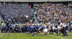 Navy Academy Midshipmen run an offensive play during the 116th Army-Navy football game at Lincoln Financial Field in Philadelphia. The Navy Midshipmen beat the Army Black Knights, 21-17. (U.S. Navy photo by Mass Communication Specialist 1st Class Felicito Rustique)