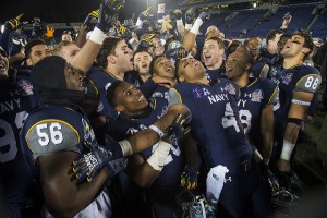 Navy celebrates their 44-28 victory over Pittsburgh in the 2015 Military Bowl at Navy-Marine Corps Stadium in Annapolis, Md. Dec. 28, 2015. (DoD News photo by EJ Hersom)