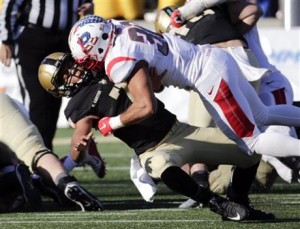 Army quarterback Chris Carter (7) is hit by Rutgers defensive back Andre Hunt (30) during the second half of an NCAA college football game on Nov. 21, 2015, in West Point. Rutgers won 31-21. (AP Photo/Mike Groll)