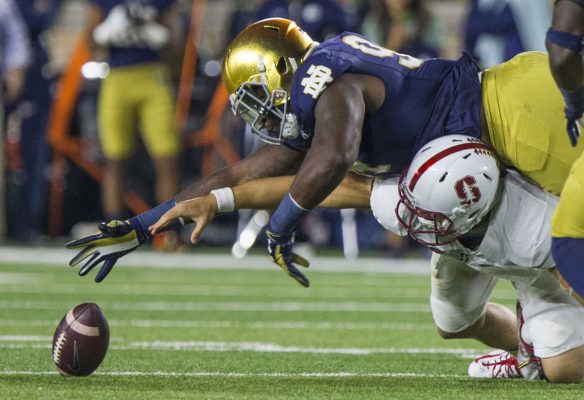 Notre Dame's Jarron Jones (94) goes over Stanford's Ryan Burnes (17) to recover a fumble. (Photo: Robert Franklin, South Bend Tribune)