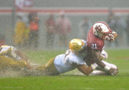 Notre Dame's James Onwualu tackles NC State's Matthew Dayes. (Grant Halverson / Getty Images)
