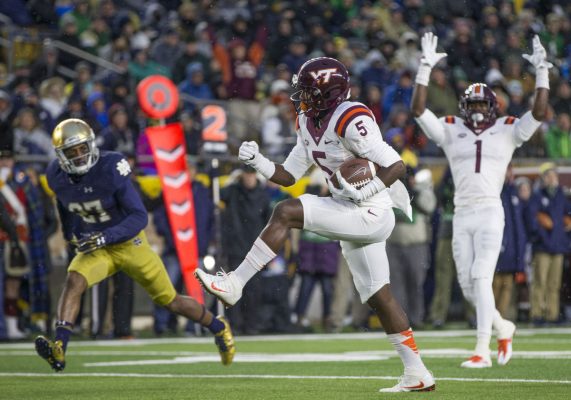 Virginia Tech's Cam Phillips runs in a touchdown in front of Notre Dame defender Julian Love. (Photo: SBT Robert Franklin)